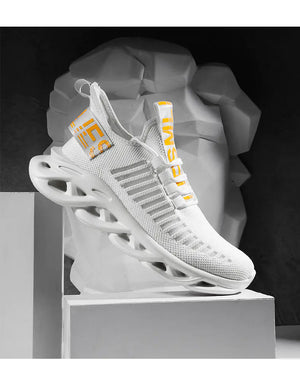 White TrailHawk running shoe with yellow heel and tongue tabs on a white display block