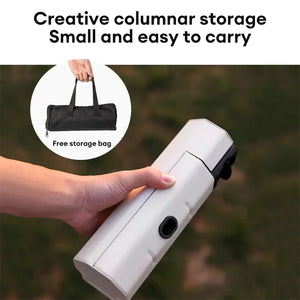 White AdventureChef stove folded shut and held in one hand, with an inset of the black carry bag
