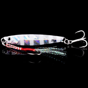 Striped silver metal jig with a treble hook and feathered assist hook
