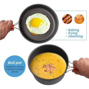 Egg frying in the pan and soup boiling in the pot