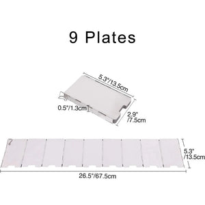 Folding windshield packed flat next to a camping stove