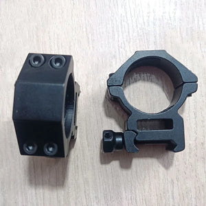 Two black SteadyRing scope rings on a table, front and side view