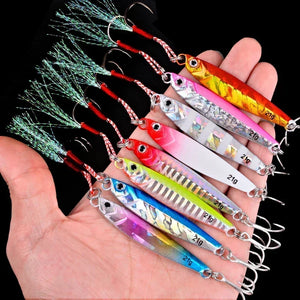 Seven metal jigs in mixed colors held in an open hand