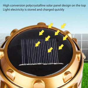 Close-up of the small solar panel on the top of a gold lantern