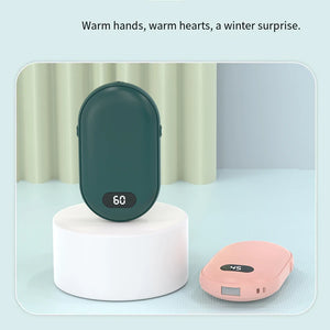 Green and pink hand warmers on white stands, digital heat display on each