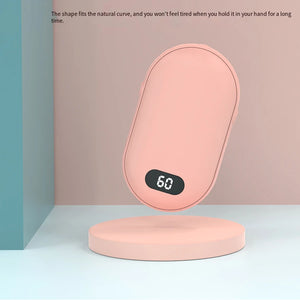 Pink hand warmer on a round stand, rounded shape made to fit your palm