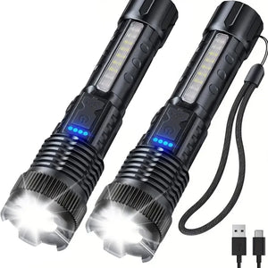 Two black zoom flashlights with wrist straps and USB-C cord