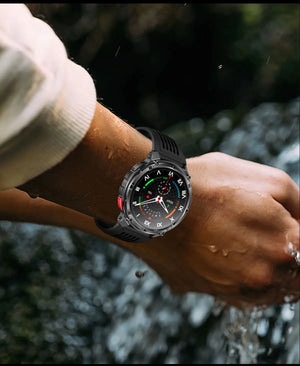 Black smartwatch on black band with Roman numeral dial on a wet wrist over running water