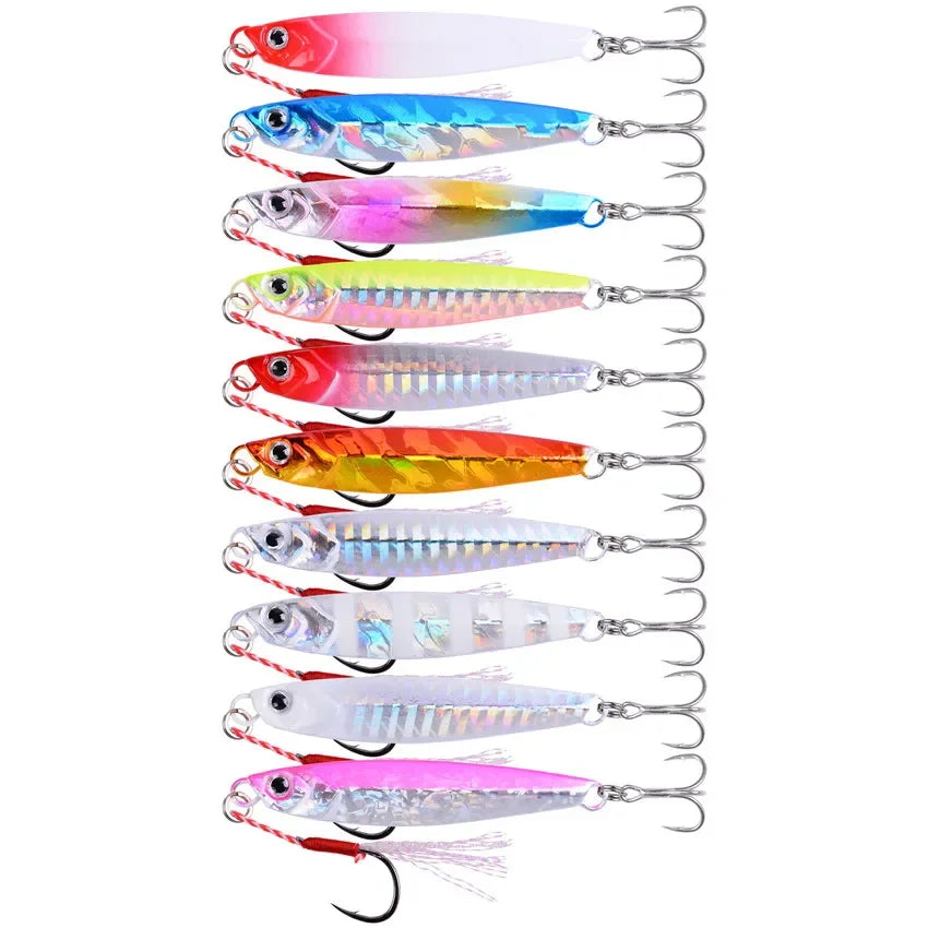 Seven metal jig lures in mixed colors with assist hooks, held in an open hand