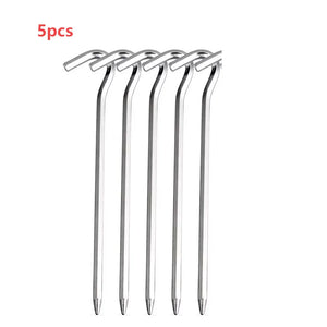 Five silver diamond-cut hook tent stakes
