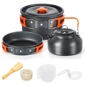 Orange pot, pan and kettle with bowls, bamboo spatula, sponge and ladle