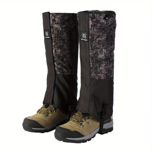 Gray digital camo DriftPeak gaiters with black lower panels on hiking boots