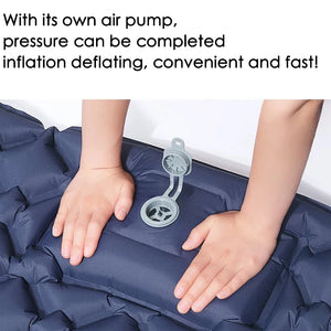 Hands pressing the built-in pump on a navy pad