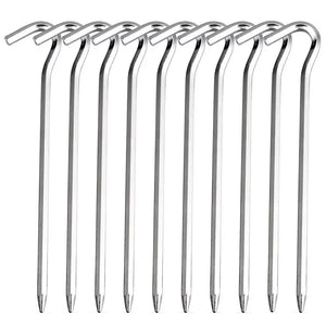 Ten silver aluminum hook tent stakes lined up side by side