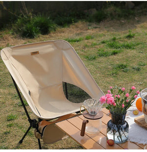 Beige moon chair on the grass at a picnic