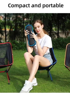 Woman holding the packed mesh chair in its bag