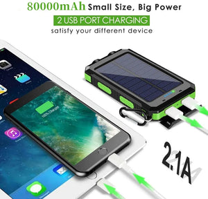 Green TrailCell power bank charging a phone through two USB ports