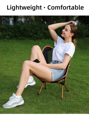 Woman relaxing in a mesh moon chair
