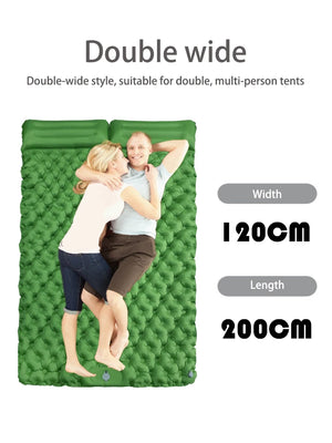 Couple lying on the green 2 person pad with two pillows