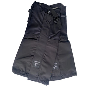 Pair of black gaiters folded flat, showing the under-boot straps and buckles