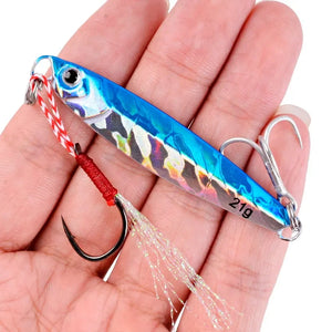 Blue holographic 21 g metal jig in a hand