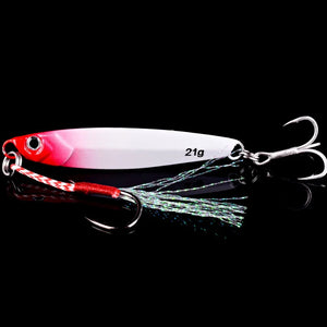 Red and white metal jig with a treble hook and feathered assist hook