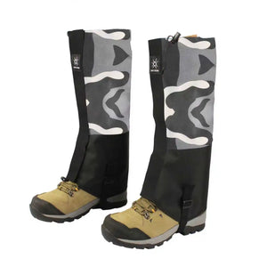 Gray and white camo gaiters with black lower panels on hiking boots