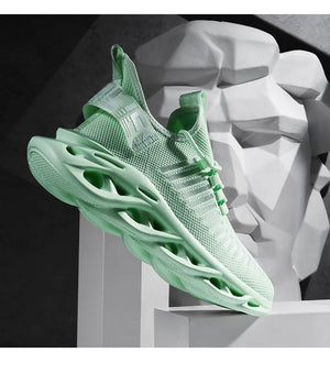Mint green TrailHawk running shoe, sole side view, on a white display block