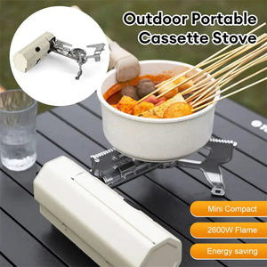 White AdventureChef cassette stove heating a pot of skewers, with a 2600W flame label