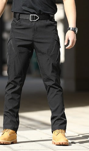 Black cargo pants worn with a belt and tan boots, front view
