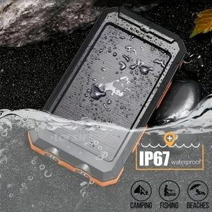 Orange solar power bank half in water on rocks, with an IP67 graphic (older model)