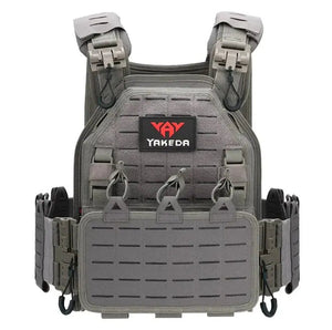 Gray FieldFrame vest, front view, with laser-cut panels, a front flap and a Yakeda logo patch