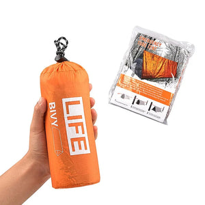 Hand holding the orange emergency tube tent stuff sack next to the sealed retail pack