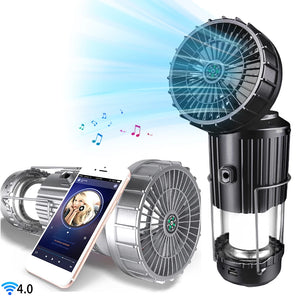 Black and silver solar lanterns with fan heads, a phone playing music beside them