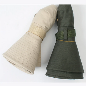 Two TactShield sun hats, tan and olive green, rolled up tight