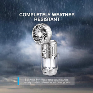 Silver lantern with a large flip-up fan in the rain, with a printed IP44 water-resistance claim