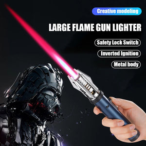 Hand holding a blue jet torch lighter with a long pink-red flame, beside a dark helmeted movie-style figure