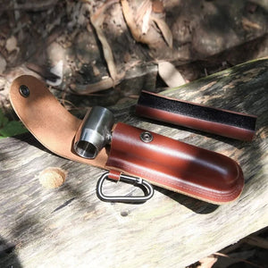 Bushcraft auger in its brown belt sheath with a carabiner