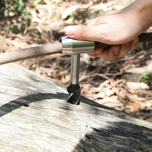 Hand turning the bushcraft auger into a log