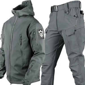 TrailShell hooded jacket in gray with chest, arm and forearm zip pockets, shown with gray cargo pants