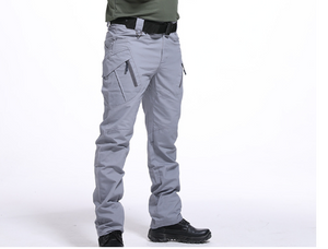 Gray cargo pants with zip hip pockets, worn with black boots