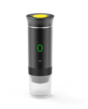 Black NomadBarista portable espresso maker with a green power light and clear cup on the bottom