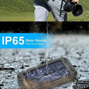 Solar power bank splashed with water, with an IP65 water graphic and a camera user above (older model)