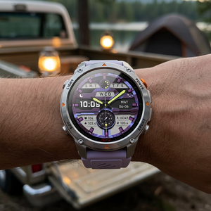 SummitNav GPS smartwatch with a grey and purple silicone band on a wrist at a lakeside campsite