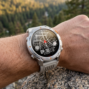 SummitNav GPS smartwatch with a light grey ribbed silicone band showing a map on a wrist at a trail overlook