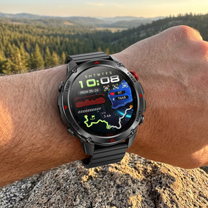 SummitNav GPS smartwatch with a black steel flat-link bracelet on a wrist at a trail overlook