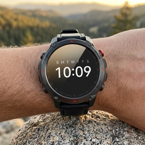 SummitNav GPS smartwatch with a black leather band on a wrist at a trail overlook at golden hour