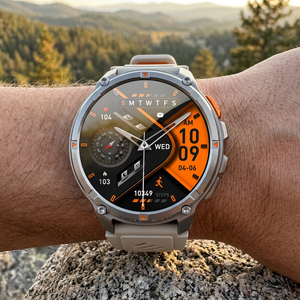 TrailCore outdoor smartwatch with a grey and orange silicone band on a wrist at a trail overlook