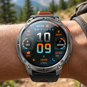 Close-up of the TrailCore smartwatch with black and orange band on a hiker's wrist, time and week on screen, trail behind